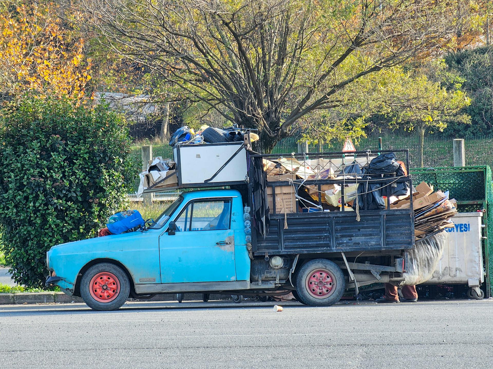 Junk hauling crew loading furniture and appliances into a truck in Murfreesboro